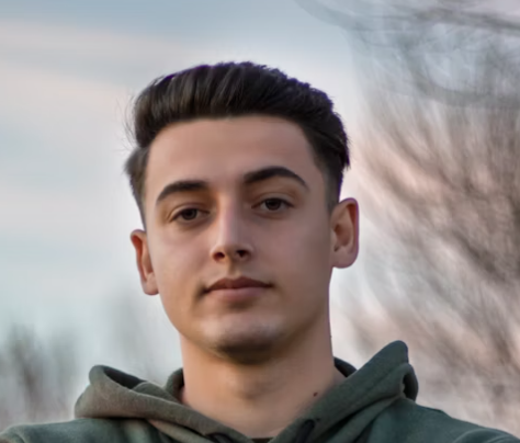 Young man outdoor hoodie portrait